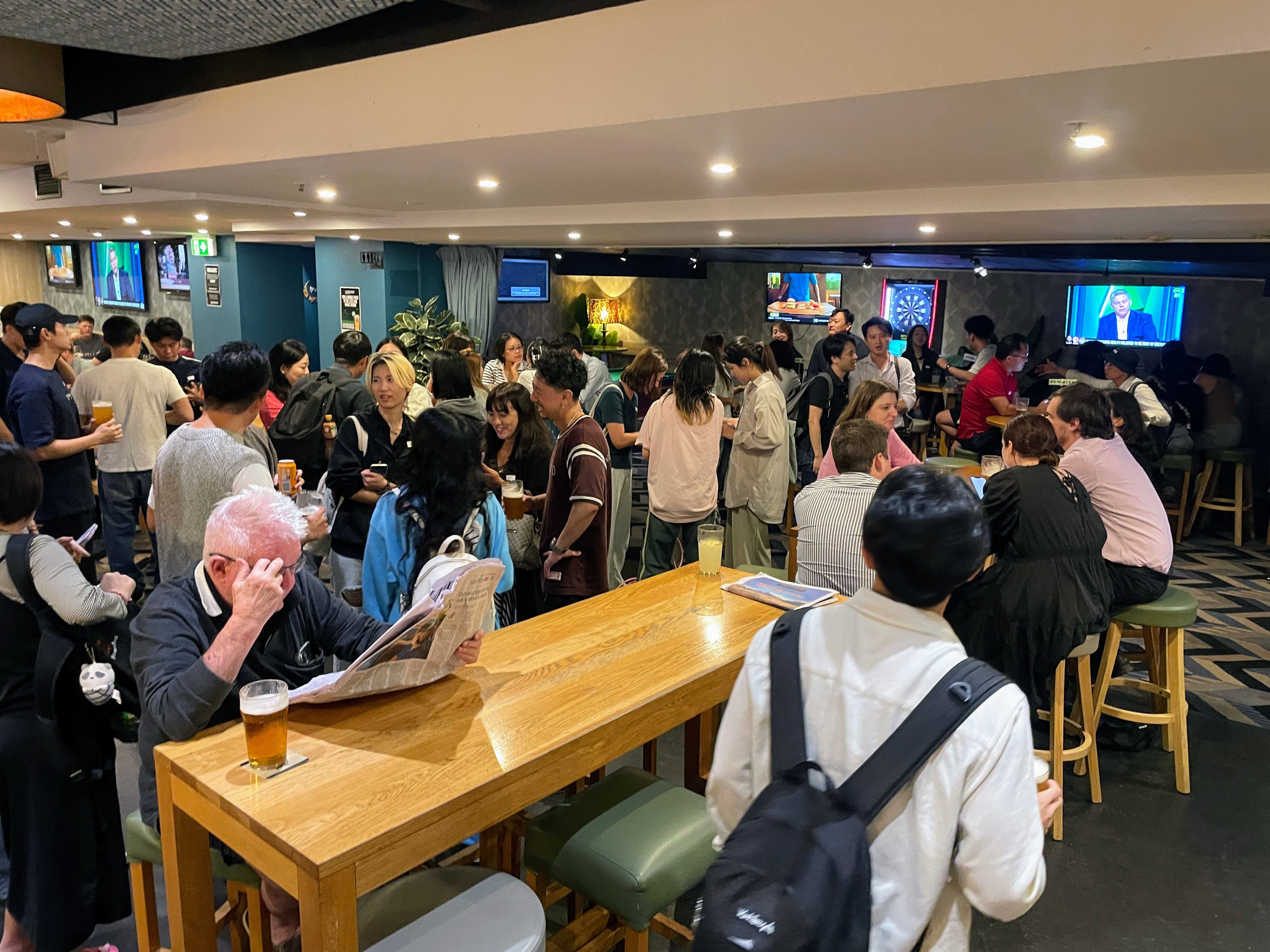 Hosted Asian meetup room with guests talking in Brisbane